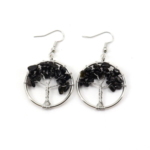 Detail of silver wire wrapped Tree of Life earrings with natural black stone chips