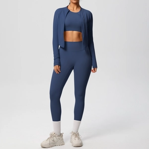 Detailed view of women's navy blue three-piece yoga set with zip jacket and high waist leggings