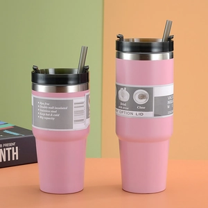 Close-up of 32oz pink stainless steel vacuum insulated tumblers with BPA-free straws