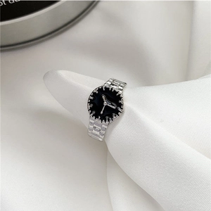 Vintage watch-style 925 silver ring with black dial on elegant white satin background