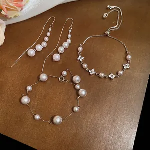 Elegant pearl jewelry set with irregular pearl earrings and bracelets in silver finish