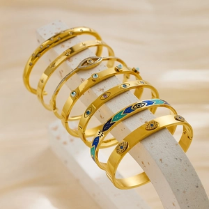 Fashionable titanium steel honeycomb bracelets with evil eye patterns in gold finish