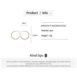 Detail view of gold hoop earrings with woven texture and 4cm x 3.5cm size specifications