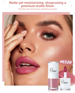 Velvet matte liquid lipstick in shade #E520 mauve pink shown on lips with applicator