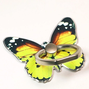 Macro view of butterfly phone ring holder featuring orange wings and silver metal hinge