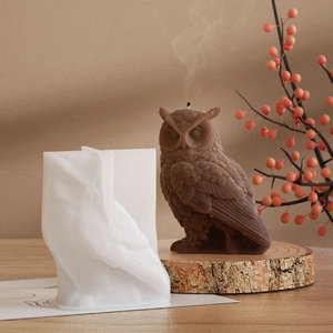 Macro shot of 3D owl silicone mold showing detailed feather textures for DIY candle making