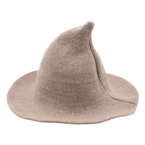 Thick wool knitted witch hat in light brown with a pointed top and wavy brim for Halloween