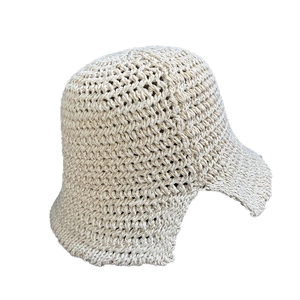 Minimalist beige crochet bucket hat for women featuring hollow knit texture and wave pattern