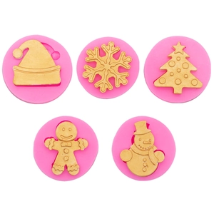 Five rose red Christmas silicone molds including snowflake and gingerbread man shapes