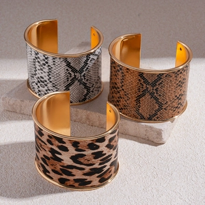 Retro geometric wide open bracelets featuring leopard and snake leather patterns in gold finish