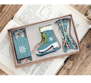 Blue wooden Christmas set featuring a mini sled, ice skates, and skis in a display box