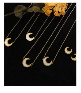 Detailed view of 18K gold plated crescent moon necklaces with white shell inlay for women