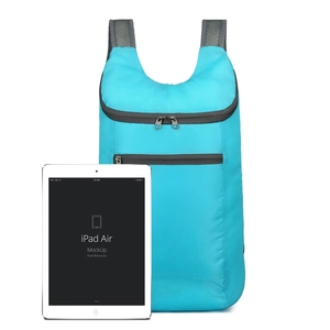 Waterproof lightweight outdoor travel backpack in cyan with iPad for size reference