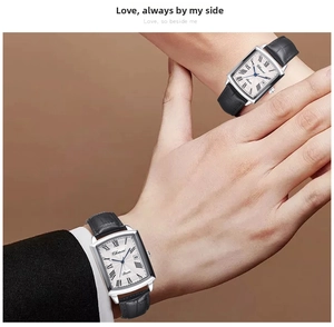 Detail of CHENXI rectangular couple quartz watches with black leather straps on wrists