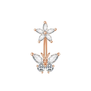Close-up of rose gold belly ring with zircon flower and butterfly charms on white background
