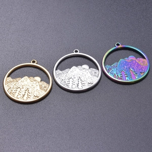 Detailed view of mountain charms in gold, silver and iridescent finishes for DIY necklaces