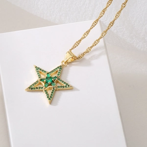 18K gold plated copper necklace with a green zircon star pendant on a white background