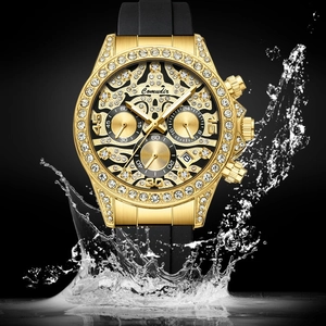 Montre Comudir dorée avec lunette en strass et bracelet noir avec effet d'éclaboussure