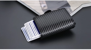 Macro view of RFID-blocking carbon fiber wallet showing the automatic pop-up card mechanism