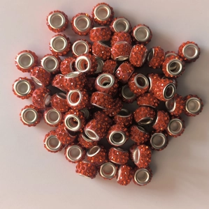 Detailed top view of sparkling orange crystal pavé large hole beads for jewelry making