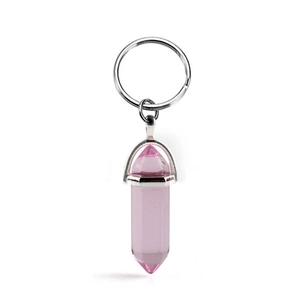 Pink natural crystal hexagonal prism keychain with silver metal clip on white background