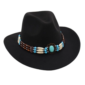 Detail of western cowboy hat with turquoise stone and ethnic style beaded band decor