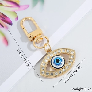 Detail view of Evil Eye keychain showing dimensions 5.8cm length and 3.2cm width
