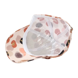 Detail view of polyester baseball cap interior featuring floral print and sweatband
