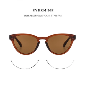 Detailed close-up of amber brown cat-eye sunglasses with high-quality acetate frame