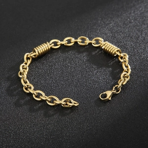 Detail of gold chain bracelet featuring unique spring ring accents and lobster clasp
