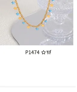 Close-up of a gold thin chain necklace featuring small gold and blue star pendants
