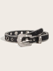 Detail of black glitter belt with silver rhinestone buckle and metal eyelets for women