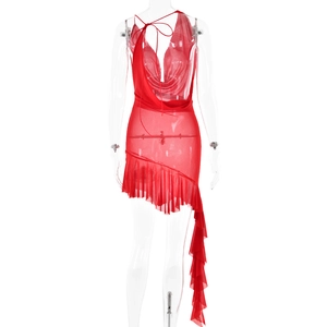 Detail view of red backless dress featuring ruffle hem and tie-up strap design