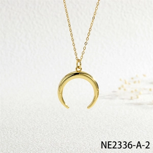 Polished gold crescent horn pendant on fine chain with elegant minimalist design