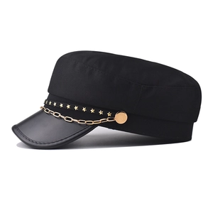 Classic black PU military cap with gold star studs and chain detail on white background
