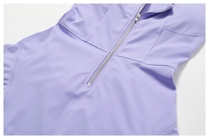 Detail of lavender athletic dress featuring a center zipper and structured seam design