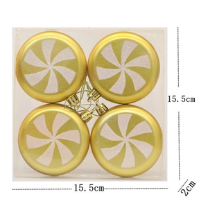 Detail view of 4-pack gold and white candy-patterned Christmas tree ornaments in a clear box