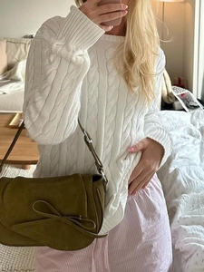 Casual white cable knit sweater and olive green suede tote bag with bow detail