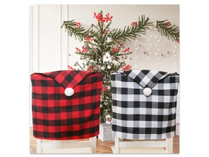Close-up of red and white plaid Christmas chair covers in a festive holiday setting