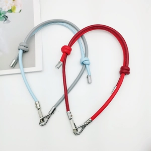 Adjustable two-tone leather phone lanyard and bag strap in light blue and red with metal hooks
