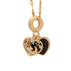 Golden double heart pendant necklace with star and moon patterns and blue zircon stones