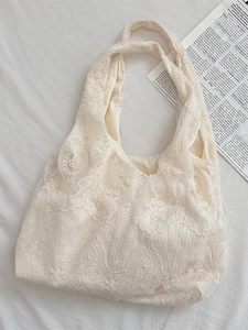 Cream lace embroidery tote bag with floral patterns in a minimalist Korean style