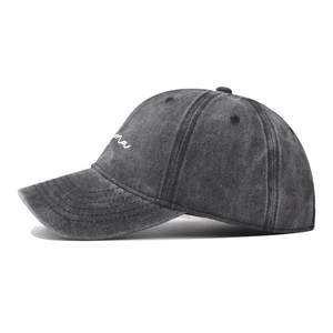 Side view detail of a vintage washed charcoal cotton baseball cap with MAMA print