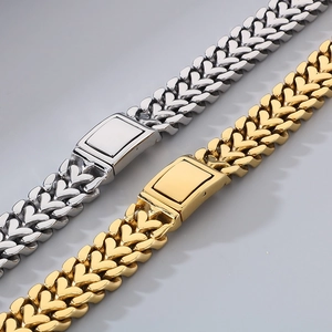 Close-up of heart-shaped link chain in gold and silver finish with square clasp