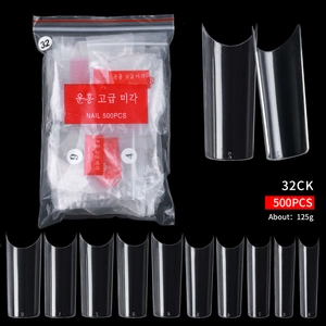 Détails macro des capsules d'ongles transparentes en 10 tailles pour manucure pro