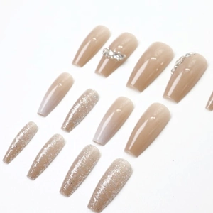 Elegant nude ballerina press-on nails with silver glitter and rhinestone accents
