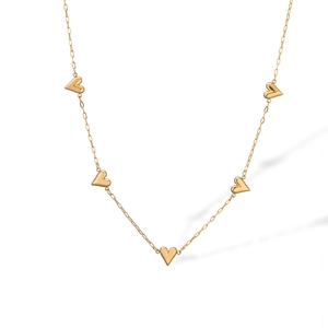 Elegant gold choker necklace featuring multiple 3D heart-shaped pendants on a white background