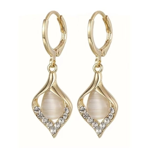 Elegant gold drop earrings with teardrop cat eye stone and rhinestone accents on white background