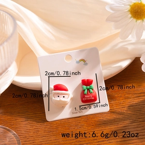 Detailed view of Santa and gift bag earrings on 925 silver card with size measurements