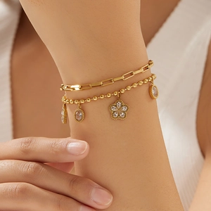 Double-layer gold stainless steel bracelet with floral charm and zircon crystal drops